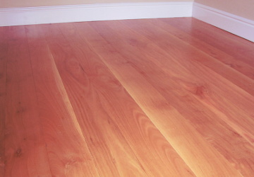 Stone Pine wooden boards used for flooring in a bedroom Bedroom with Stone Pine flooring